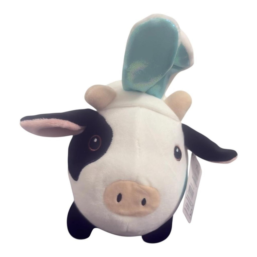 Celebrate! Plush cow toy with a cute teal bow. Soft...
